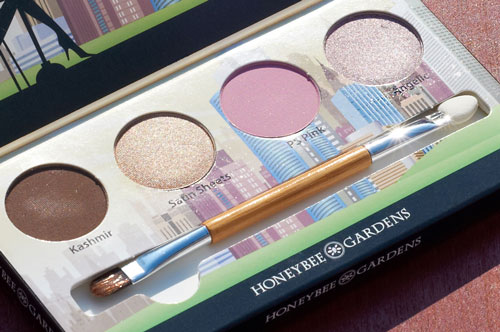 A close-up of pressed eyeshadows inside the palette